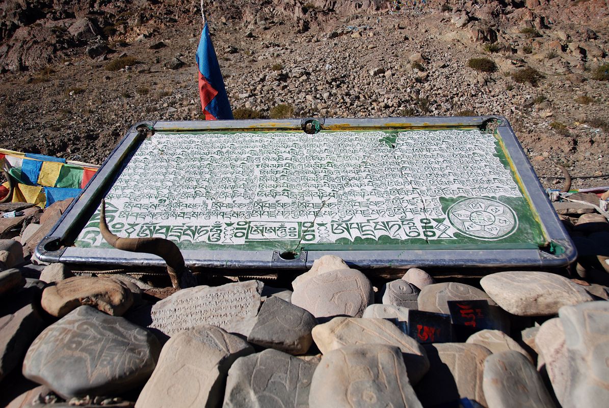 43 Mani Wall In Darchen Tibet Has A Mani Pool Table I walk up the main street of Darchen to a mani wall on the northern edge of town. This mani wall had a few pool tables modified to a more religious perspective  very creative.